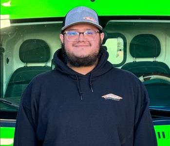 Austin SERVPRO of Centennial Hills Production Technician standing in front of SERVPRO vehicle. 