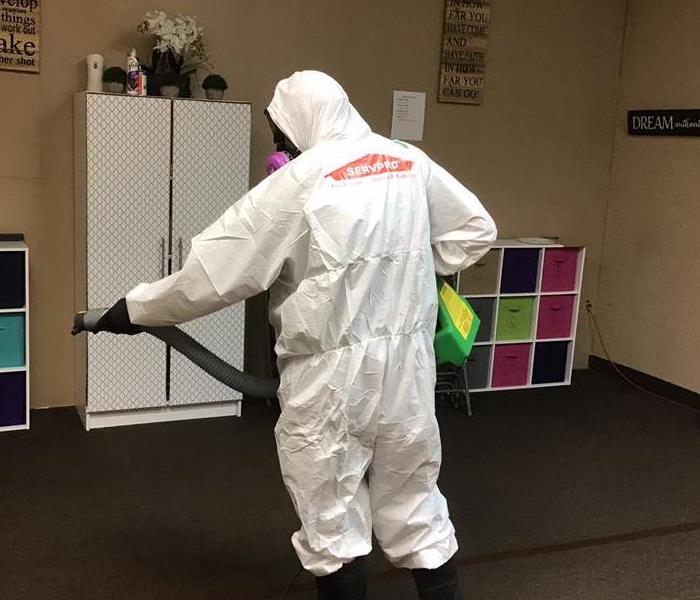 SERVPRO employee fogging a classroom 