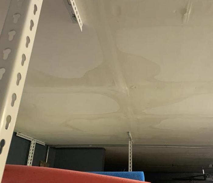 Water damage on garage ceiling from rain storm